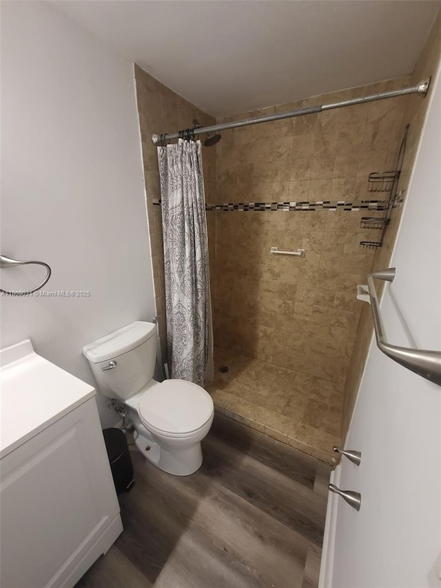 600 Layne Blvd Unit 118, Hallandale Beach, FL 33009 - full bath with wood finished floors, toilet, a shower stall, and vanity