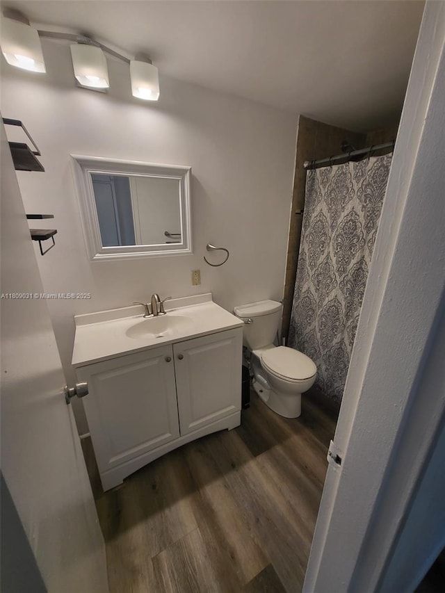 600 Layne Blvd Unit 118, Hallandale Beach, FL 33009 - full bath featuring vanity, wood finished floors, toilet, and a shower with curtain