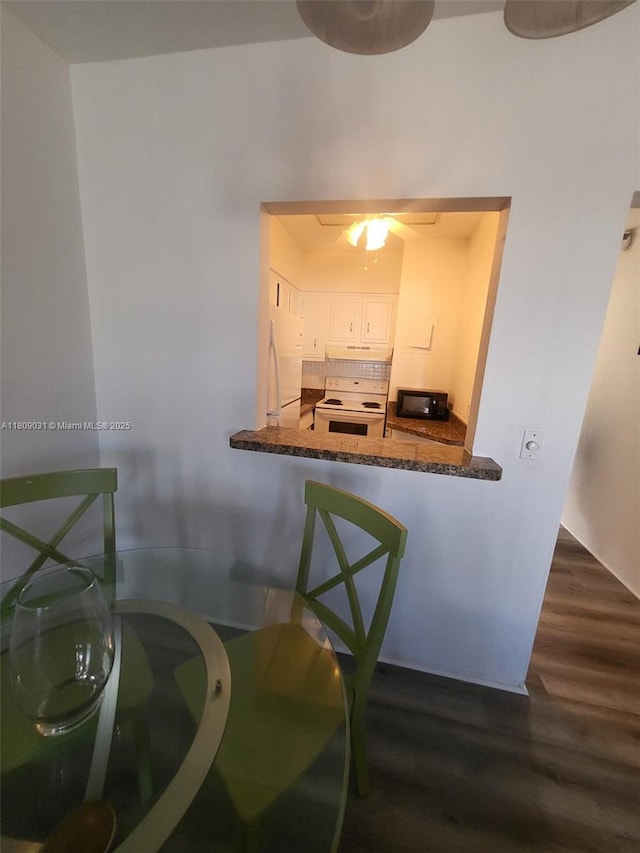 600 Layne Blvd Unit 118, Hallandale Beach, FL 33009 - dining area with dark wood-type flooring and a ceiling fan