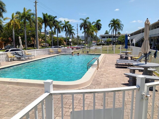 600 Layne Blvd Unit 118, Hallandale Beach, FL 33009 - community pool featuring a patio