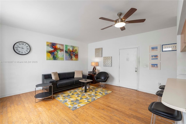 1200 Euclid Ave Unit 206, Miami Beach, FL 33139 - living room with a ceiling fan, wood finished floors, and baseboards