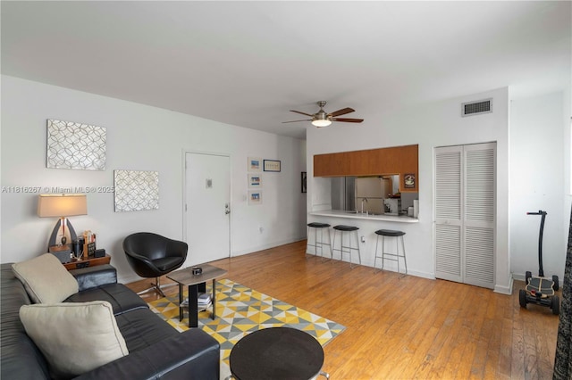1200 Euclid Ave Unit 206, Miami Beach, FL 33139 - living area featuring light wood-type flooring, a ceiling fan, and baseboards