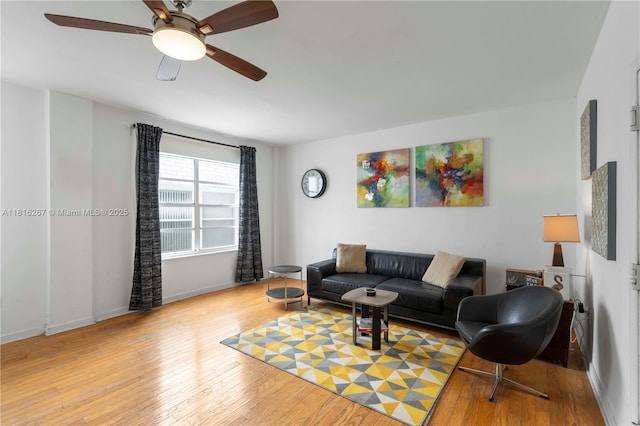 1200 Euclid Ave Unit 206, Miami Beach, FL 33139 - living area with wood-type flooring, baseboards, and ceiling fan