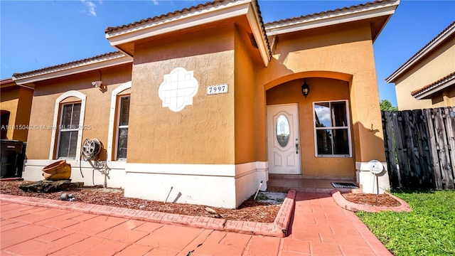 7997 NW 199th Ter, Hialeah, FL 33015 - view of front facade with stucco siding and a tiled roof
