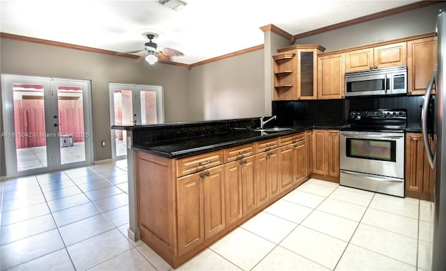 7997 NW 199th Ter, Hialeah, FL 33015 - kitchen with stainless steel appliances, crown molding, a peninsula, ceiling fan, and french doors