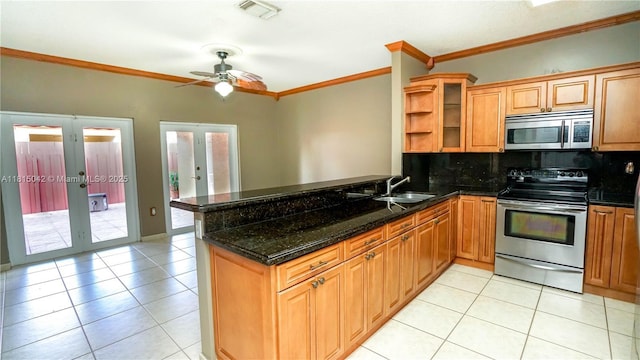 7997 NW 199th Ter, Hialeah, FL 33015 - kitchen featuring appliances with stainless steel finishes, french doors, crown molding, a peninsula, and tasteful backsplash
