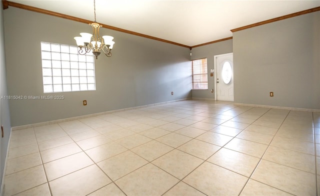 7997 NW 199th Ter, Hialeah, FL 33015 - unfurnished room with light tile patterned floors, crown molding, and a chandelier