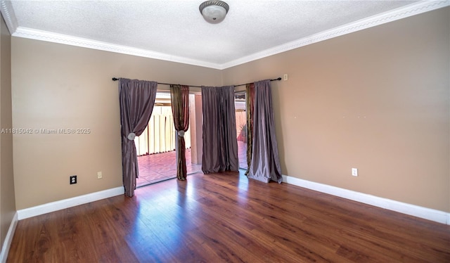 7997 NW 199th Ter, Hialeah, FL 33015 - unfurnished room featuring a textured ceiling, wood finished floors, and crown molding