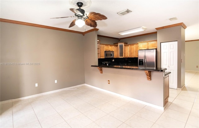 7997 NW 199th Ter, Hialeah, FL 33015 - kitchen with stainless steel appliances, a ceiling fan, ornamental molding, a kitchen bar, and a peninsula