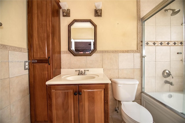 7997 NW 199th Ter, Hialeah, FL 33015 - full bath with tile walls, vanity, a wainscoted wall, and enclosed tub / shower combo