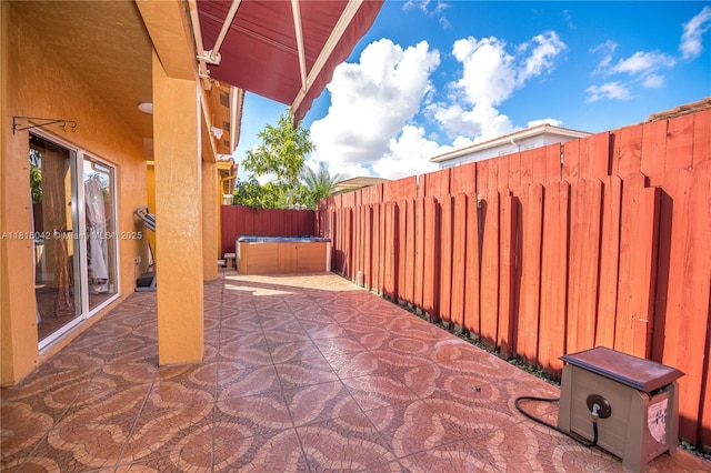 7997 NW 199th Ter, Hialeah, FL 33015 - fenced backyard featuring a hot tub and a patio