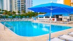 19201 Collins Ave Unit 441, Sunny Isles Beach, FL 33160 - community pool featuring a patio