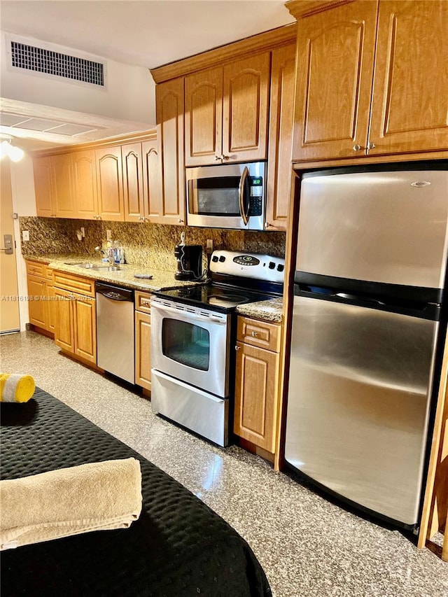 19201 Collins Ave Unit 441, Sunny Isles Beach, FL 33160 - kitchen featuring stainless steel appliances, tasteful backsplash, a sink, and granite floors
