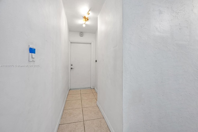 2465 SW 18th Ave Unit 3210, Miami, FL 33145 - hallway with light tile patterned floors and baseboards