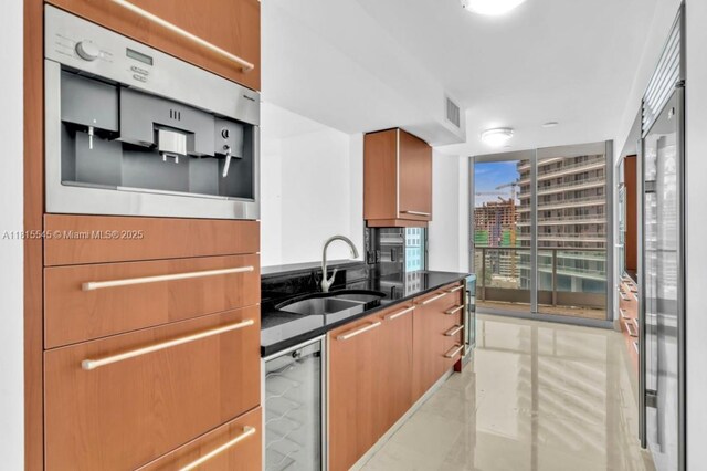 1331 Brickell Bay Dr Unit 1808, Miami, FL 33131 - kitchen with a sink and dark stone counters
