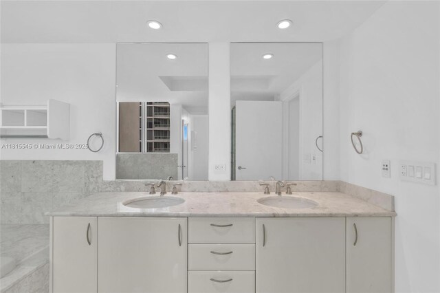 1331 Brickell Bay Dr Unit 1808, Miami, FL 33131 - full bath with double vanity, recessed lighting, and a tub with marble appearance