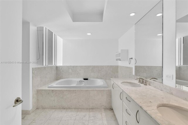 1331 Brickell Bay Dr Unit 1808, Miami, FL 33131 - bathroom featuring a garden tub, double vanity, and recessed lighting