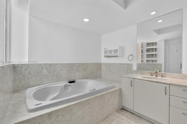 1331 Brickell Bay Dr Unit 1808, Miami, FL 33131 - bathroom with vanity, a bath, recessed lighting, and marble look tile flooring