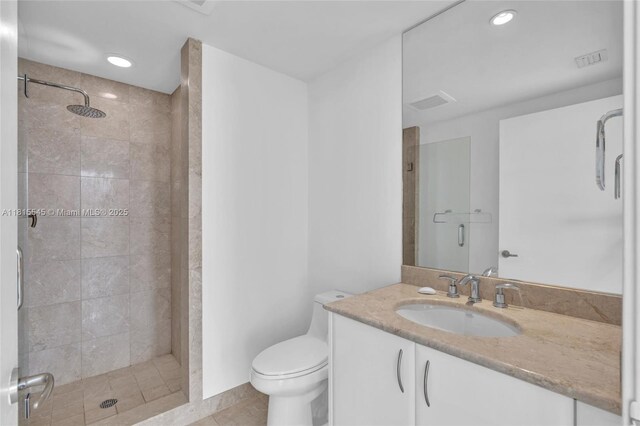 1331 Brickell Bay Dr Unit 1808, Miami, FL 33131 - bathroom with a stall shower, vanity, toilet, recessed lighting, and tile patterned floors