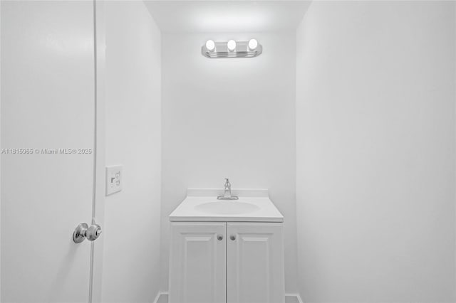 9800 W Bay Harbor Dr Unit 401, Bay Harbor Islands, FL 33154 - bathroom featuring vanity and baseboards