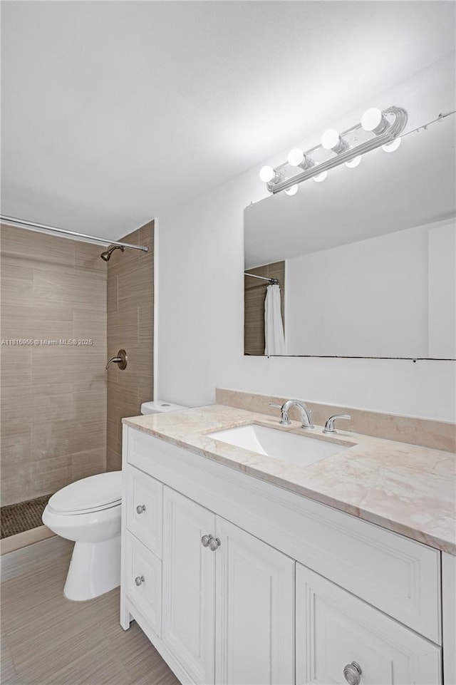 9800 W Bay Harbor Dr Unit 401, Bay Harbor Islands, FL 33154 - full bath featuring vanity, tiled shower, and toilet