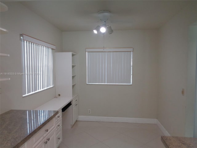 900 SW 125th Way Unit 112R, Pembroke Pines, FL 33027 - unfurnished dining area with a ceiling fan, light tile patterned floors, and baseboards