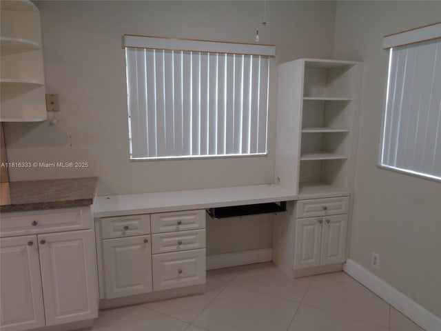 900 SW 125th Way Unit 112R, Pembroke Pines, FL 33027 - unfurnished office featuring light tile patterned flooring, built in study area, and baseboards