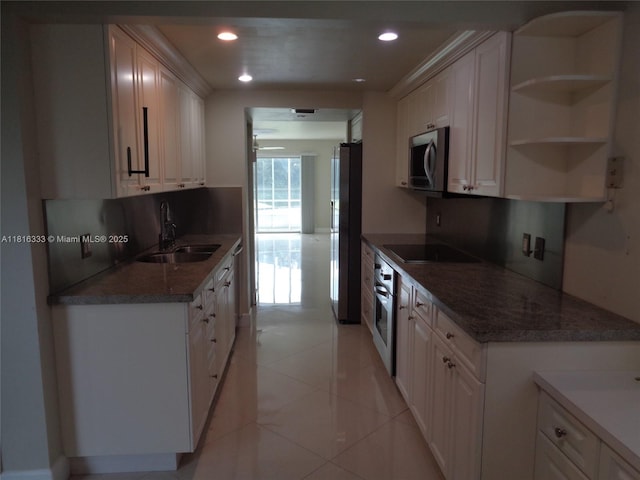 900 SW 125th Way Unit 112R, Pembroke Pines, FL 33027 - kitchen with a sink, appliances with stainless steel finishes, recessed lighting, dark stone counters, and light tile patterned flooring