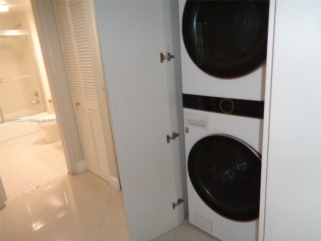 900 SW 125th Way Unit 112R, Pembroke Pines, FL 33027 - washroom with stacked washer / drying machine and tile patterned flooring