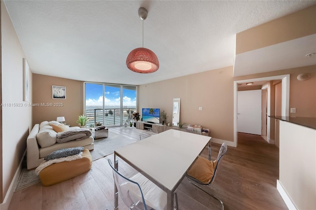 335 S Biscayne Blvd Unit 3110, Miami, FL 33131 - living area with wood finished floors, floor to ceiling windows, and a textured ceiling