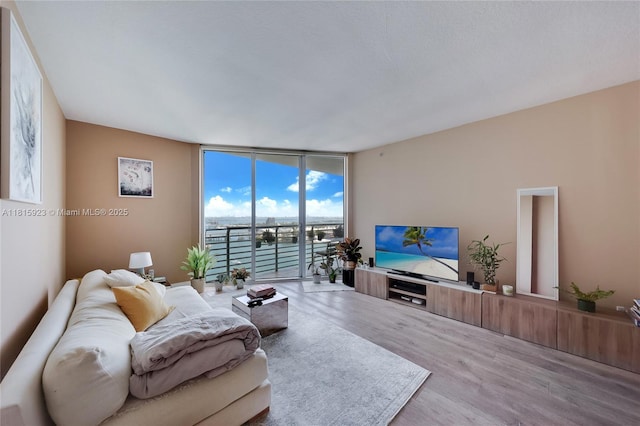 335 S Biscayne Blvd Unit 3110, Miami, FL 33131 - living room featuring a wall of windows and wood finished floors