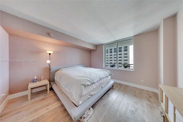 335 S Biscayne Blvd Unit 3110, Miami, FL 33131 - bedroom featuring light wood-style flooring