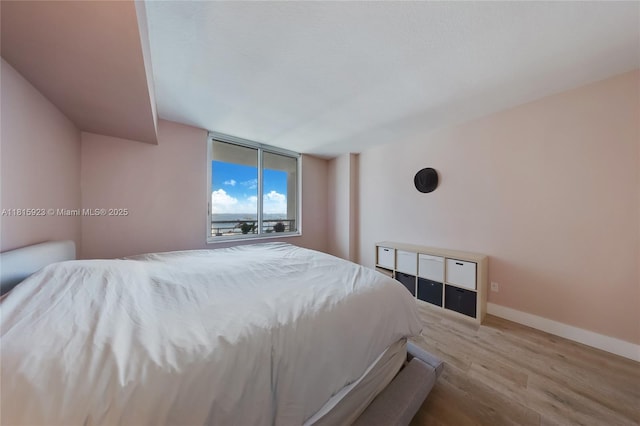 335 S Biscayne Blvd Unit 3110, Miami, FL 33131 - bedroom featuring wood finished floors and baseboards