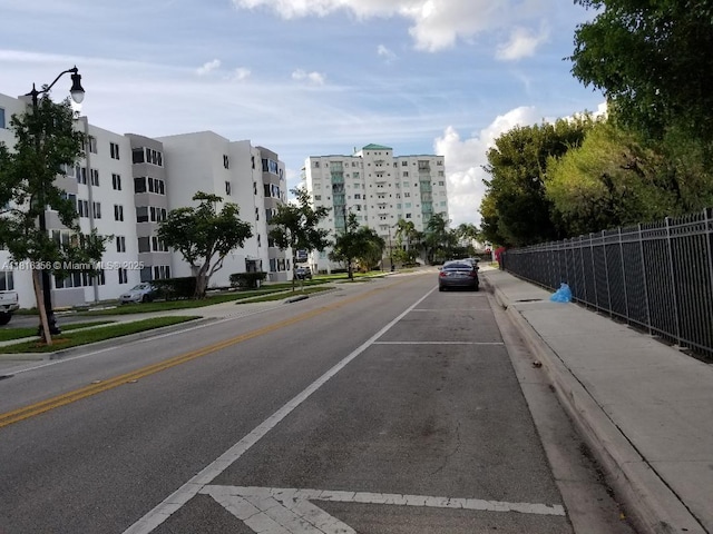 250 180th Dr Unit 159, Sunny Isles Beach, FL 33160 - view of asphalt street with sidewalks, curbs, and street lights