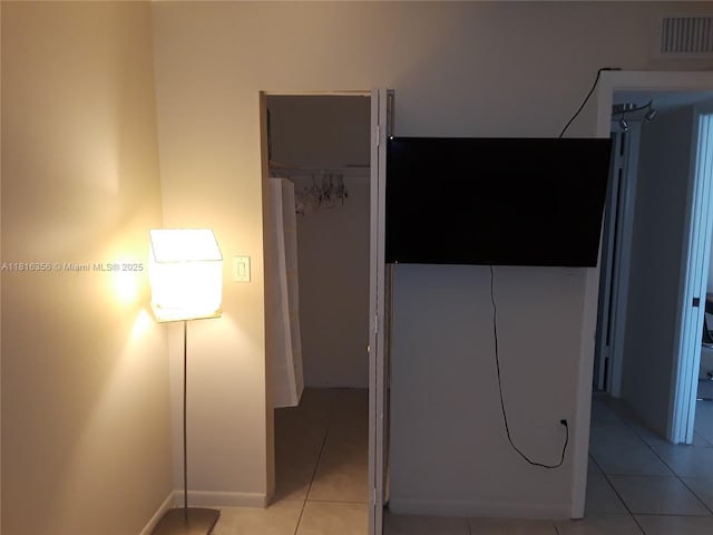 250 180th Dr Unit 159, Sunny Isles Beach, FL 33160 - unfurnished bedroom with light tile patterned floors, baseboards, and a closet