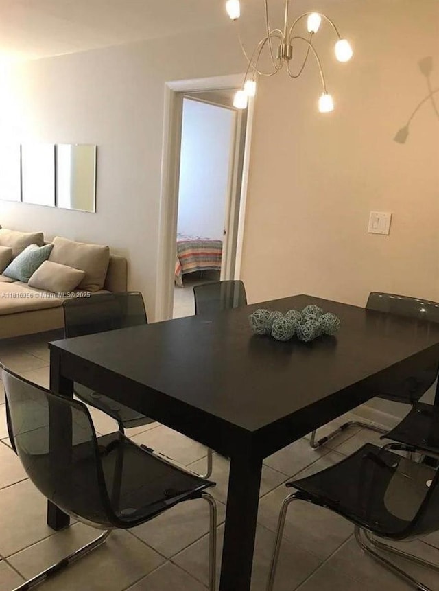 250 180th Dr Unit 159, Sunny Isles Beach, FL 33160 - dining area featuring tile patterned floors and a chandelier