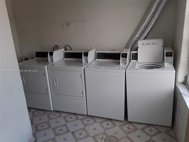250 180th Dr Unit 159, Sunny Isles Beach, FL 33160 - shared laundry room featuring independent washer and dryer