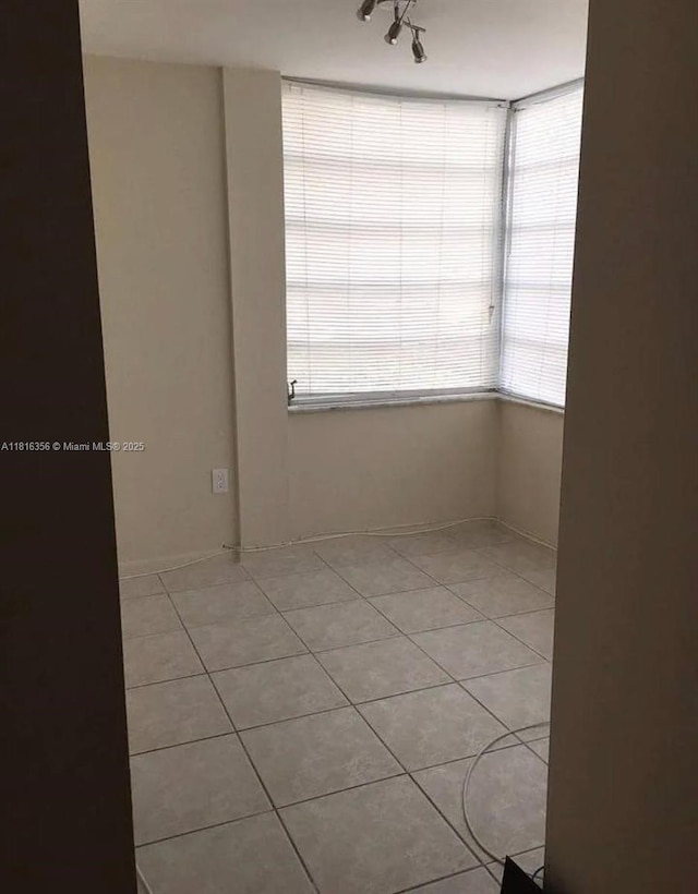 250 180th Dr Unit 159, Sunny Isles Beach, FL 33160 - unfurnished room featuring light tile patterned floors and track lighting