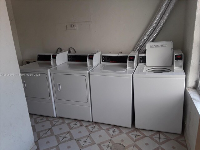 250 180th Dr Unit 159, Sunny Isles Beach, FL 33160 - shared laundry room featuring independent washer and dryer