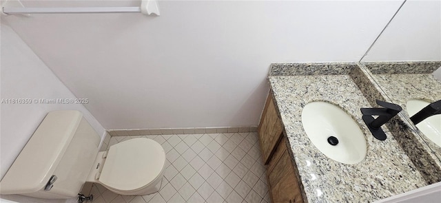 half bath with vanity and toilet