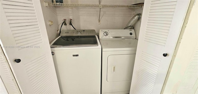 laundry area with washing machine and dryer