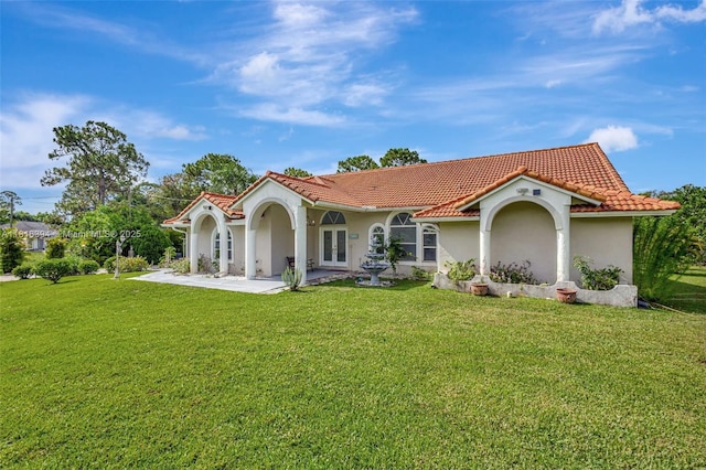 17084 N 33rd Rd N, Loxahatchee, FL 33470 - back of house with french doors, a tiled roof, a lawn, and stucco siding