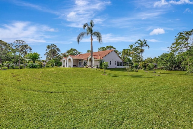 17084 N 33rd Rd N, Loxahatchee, FL 33470 - view of grassy yard with a garage
