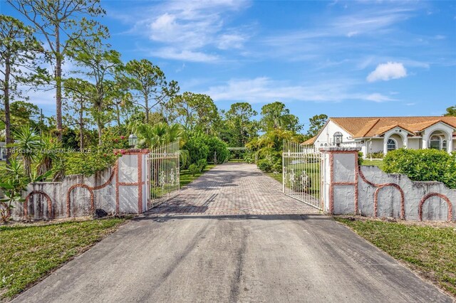 17084 N 33rd Rd N, Loxahatchee, FL 33470 - view of road with a gate and a gated entry
