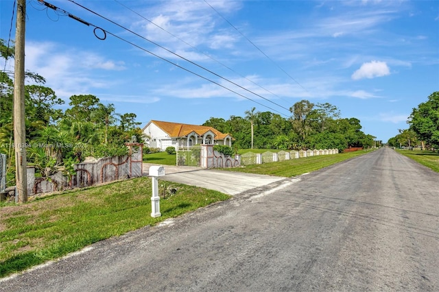 17084 N 33rd Rd N, Loxahatchee, FL 33470 - view of asphalt road with a gate