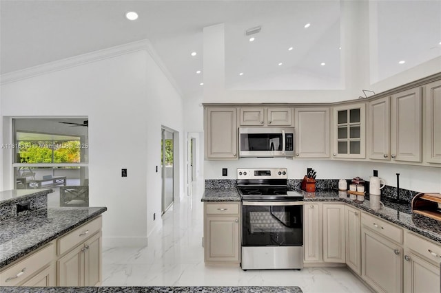 17084 N 33rd Rd N, Loxahatchee, FL 33470 - kitchen featuring stainless steel appliances, cream cabinets, light marble finish floors, recessed lighting, and crown molding