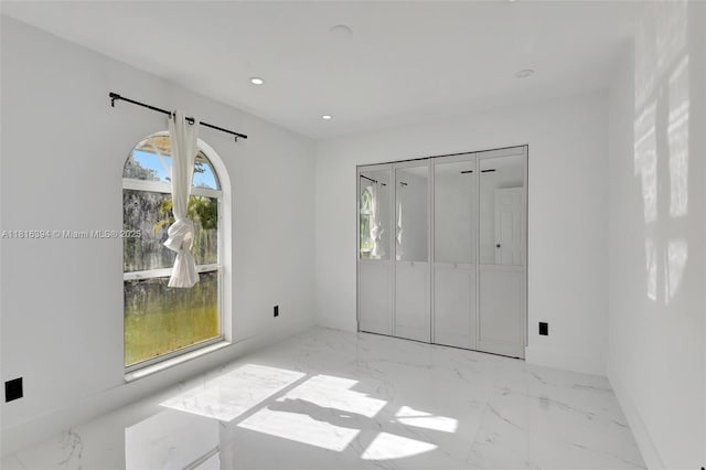 17084 N 33rd Rd N, Loxahatchee, FL 33470 - unfurnished bedroom featuring marble tiled floors, recessed lighting, and baseboards