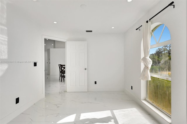 17084 N 33rd Rd N, Loxahatchee, FL 33470 - empty room featuring marble tiled floors, recessed lighting, and baseboards