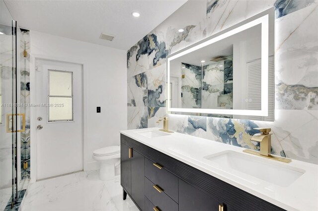 17084 N 33rd Rd N, Loxahatchee, FL 33470 - full bath with a marble finish shower, double vanity, toilet, marble finish flooring, and recessed lighting
