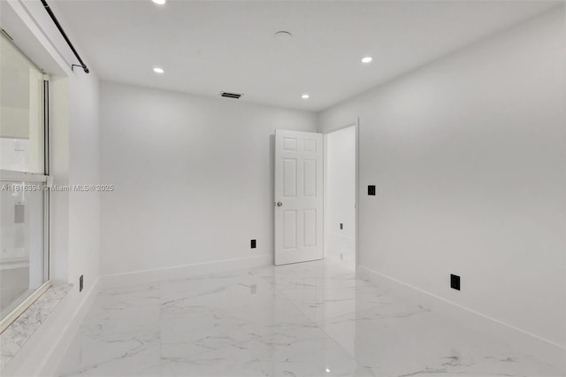 17084 N 33rd Rd N, Loxahatchee, FL 33470 - empty room featuring marble tiled floors, recessed lighting, and baseboards